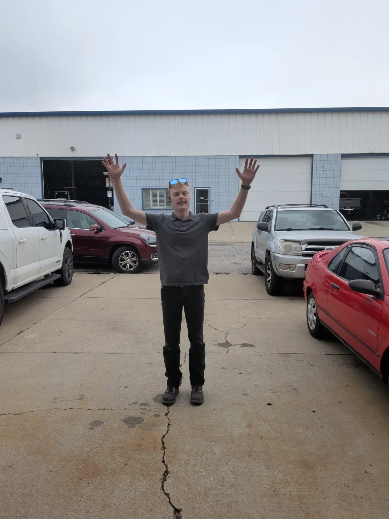 Carson Warren, WARV Marketing and IT Administrator, outside the shop