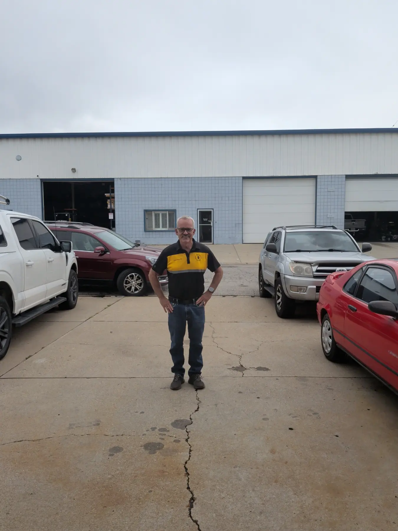 Tony Walgrave, WARV Customer Advocacy Artist, smiling outside the shop